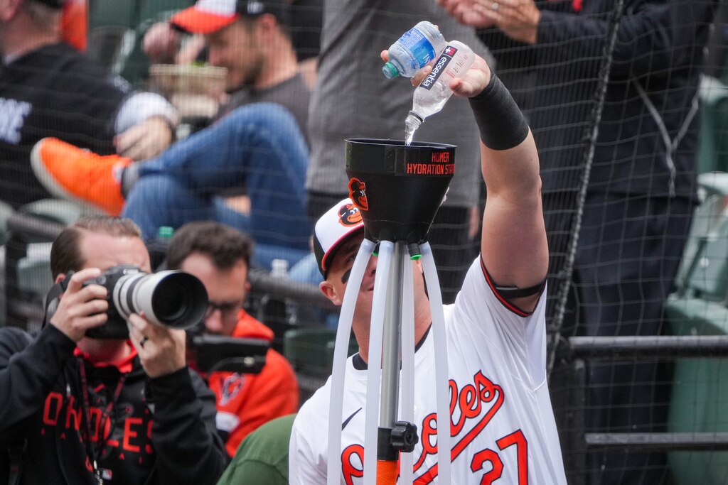 Baltimore Orioles catcher James McCann (27) preps the Homer Hydration Station after Gunnar Henderson’s home run during game three of a series against the Minnesota Twins at Camden Yards on April 17, 2024. The Orioles won Wednesday, 4-2, to sweep the series against the Twins.