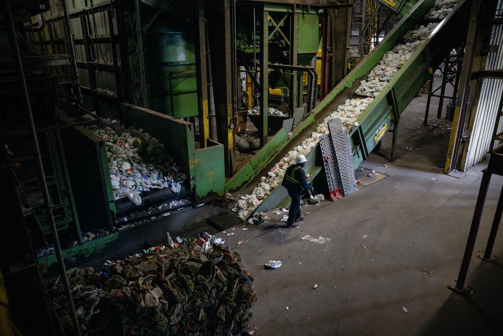 Sorted plastic milk cartons flow through various conveyor belts within the Materials Recovery Facility located at the Baltimore County Central Acceptance Facility on May 23rd, 2025 in Cockeysville, MD.