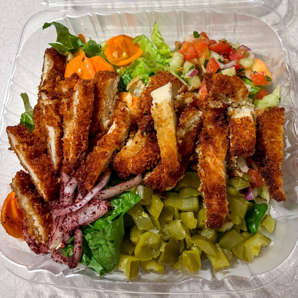 The Israeli salad with schnitzel from Yesh Hummus, in Pikesville, proved filling and delicious. We ate it for three days!