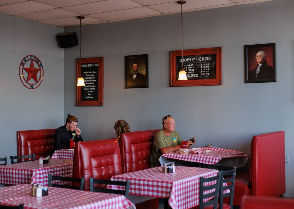 People dine at Water's Edge Cafe in downtown Crisfield, MD on April 26, 2025.