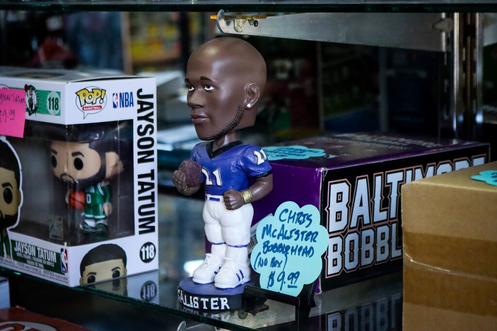 Former Baltimore Raven Chris McAlister as a bobble head is displayed in a glass case at DugoutZone in Ellicott City.