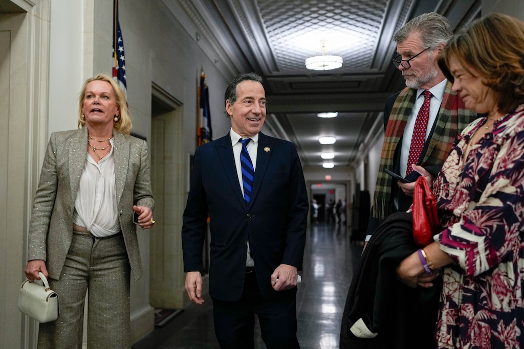 U.S. Reps. April McClain Delaney, left, and Jamie Raskin, middle, greet each other in the hallway of the Longworth House Office Building next to the U.S. Capitol in Washington, D.C. on Friday, January 3, 2025.