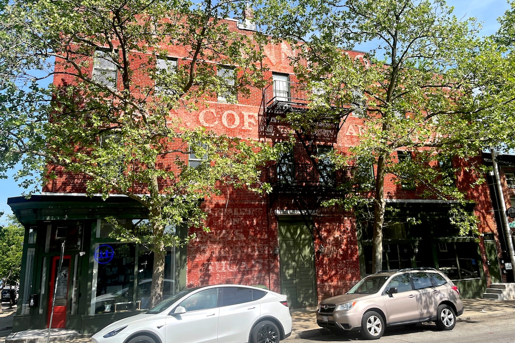 The C.D. Kenny Co., an importer of tea and coffee, sign across from Hollins Market is still very visible. The owners of the building and the architecture and development company inside dug deep into the building and the sign's history.