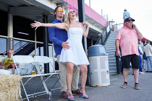 Jennifer Drumgool and Jake Little dance together to Wyclef Jean on Preakness Day at Pimlico Race Course in Baltimore, Md. on Saturday, May 17, 2025.