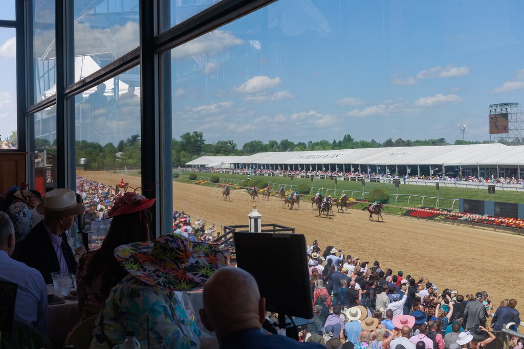 Attendees watch The Chick Lang Stakes in The Clubhouse ahead of The Preakness Stakes at Pimlico Race Course on Saturday, May 17, 2025, in Baltimore.