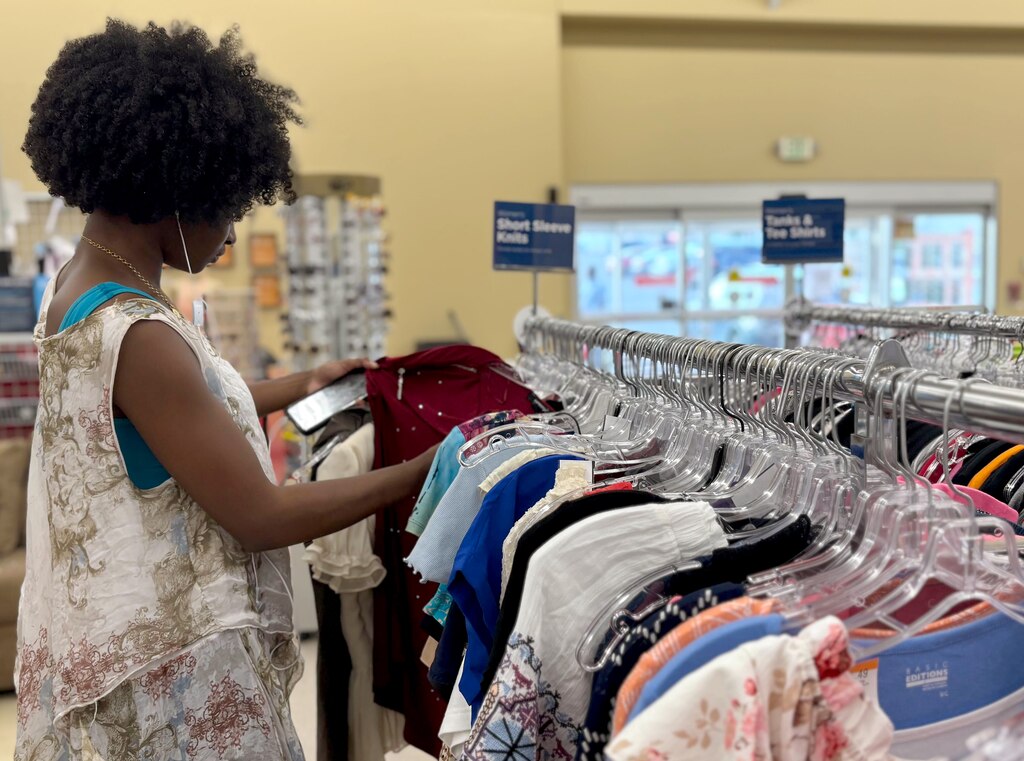 Karis Wyatt, 17, browses through clothes at Savers, a thrift store on Joppa Road in Parkville on July 2, 2025.