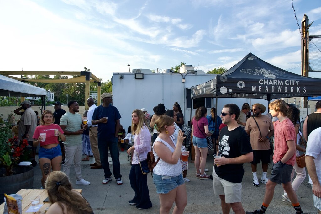 The Concession Stand, the food truck at The Peabody Heights Brewery in Baltimore, serves food to customers on July 11, 2025.
