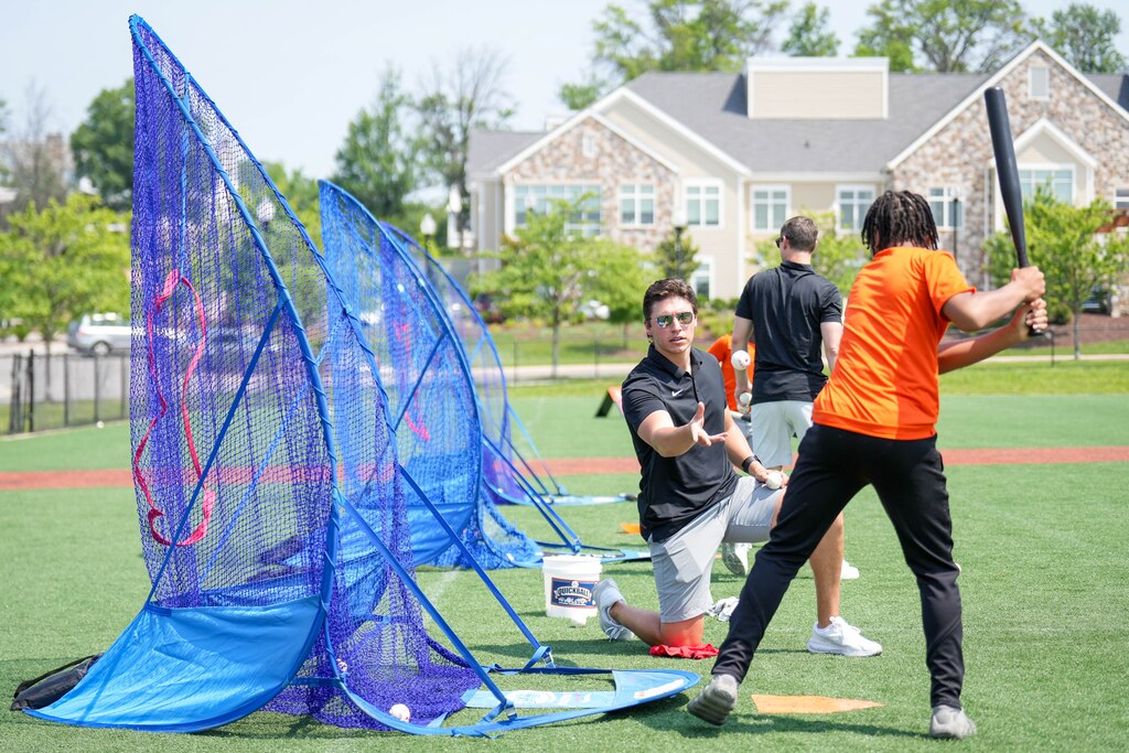 Taylor Hodges, program coordinator for the Cal Ripken, Sr. Foundation, coaches a James Mosher Baseball League player during a baseball clinic at Stadium Place, former site of Baltimore Memorial Stadium, in Baltimore, Md. on Thursday, June 12, 2025. Cal Ripken Jr., along with the Cal Ripken Sr. Foundation and MLB’s Nike RBI program, launched an initiative Thursday to expand access to the sport for youth around the country.