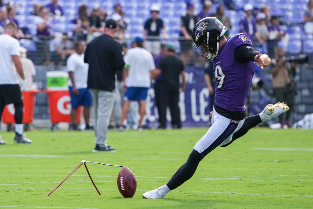 Baltimore Ravens place kicker Justin Tucker (9) practices a field goal during warmups of a preseason game against the Philadelphia Eagles at M&T Bank Stadium on Saturday, August 12, 2023.