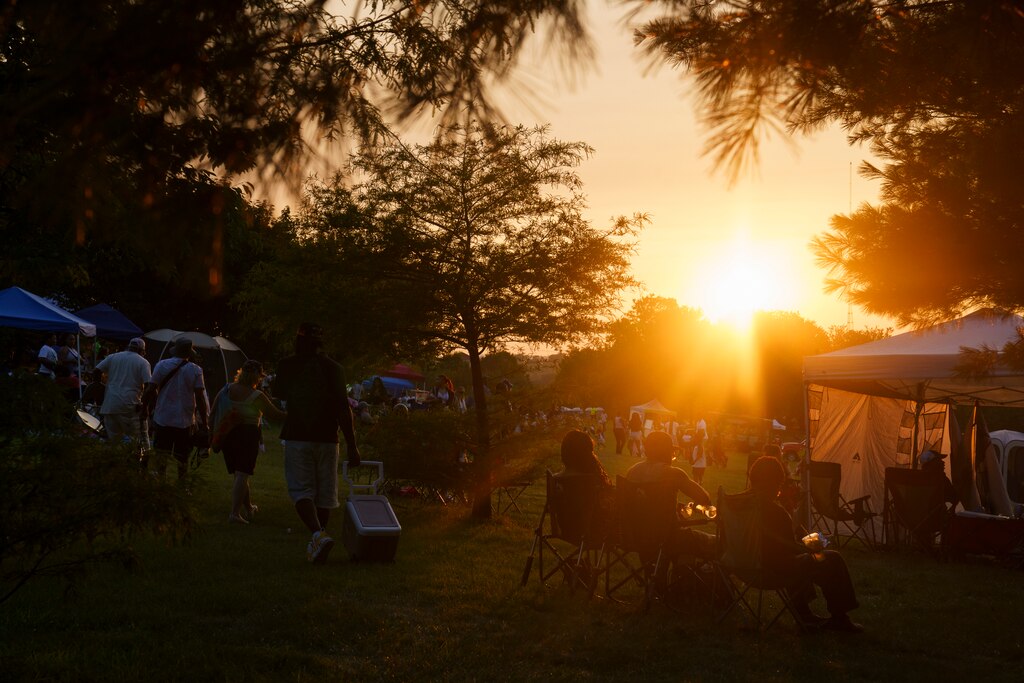 The sun sets over the Cherry Hill festival in Baltimore on July 4, 2025.
