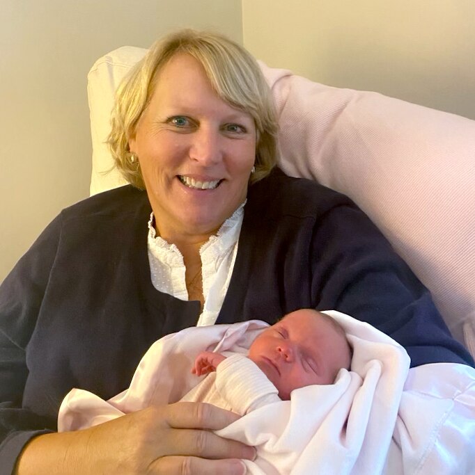Kingsley Mooney holds one of her grandchildren.