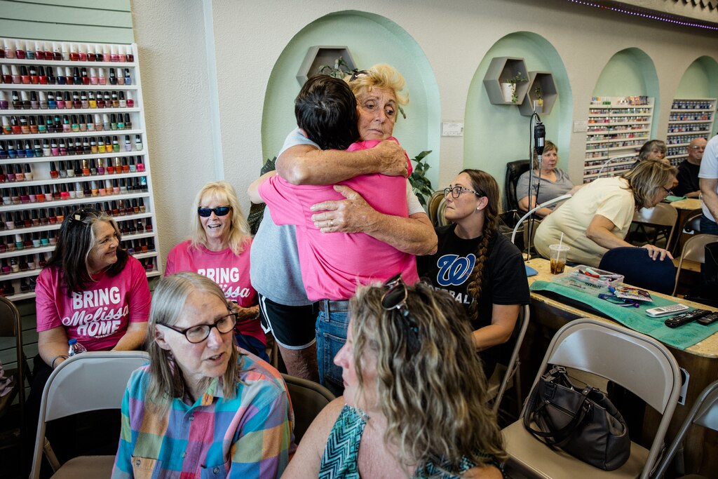 HAGERSTOWN, MD – June 4, 2025: A local resident hugs Dung “Danny” Hoang, 55, at Nail Palace and Spa in Hagerstown on June 4, 2025. The community has organized a fundraising and action meeting to help bring his wife, Mong “Melissa” Tuyen Thi Tran, back from ICE custody.