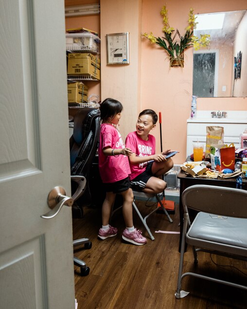 HAGERSTOWN, MD – June 4, 2025: Jacob Hoang, 10, and his sister, Riley, 6, play, eat and spend time in a back room at Nail Palace and Spa in Hagerstown on June 4, 2025.