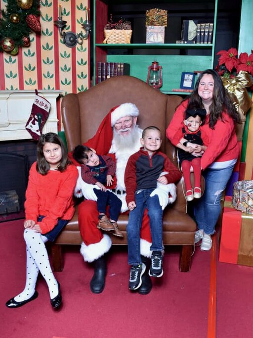Leslie Hughan and her children with Santa.