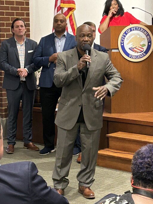 Mario Minor, founder and CEO of Maryland-based Market Fresh Gourmet grocery store, speaks during the casino town hall Sunday, April 14, 2024, at the Petersburg Public Library.