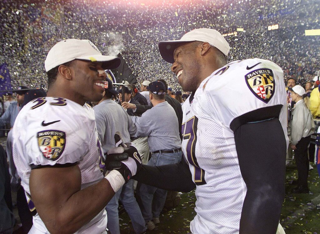 28 Jan 2001: Priest Holmes #33 and O.J. Brigance of the Baltimore Ravens celebrate after defeating the New York Giants 34-7 in Super Bowl XXXV at Raymond James Stadium in Tampa, Florida. DIGITAL IMAGE. Mandatory Credit: Tom Hauck/ALLSPORT