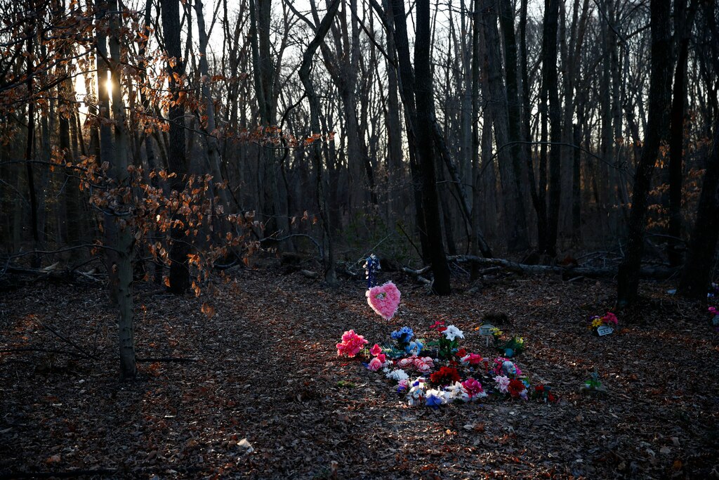 FILE - Flowers adorn Anton Black's gravesite in the corner of a cemetery, Jan. 28, 2019, in Kent County, Md. A federal judge on Tuesday, Jan. 19, 2022, has refused to throw out a lawsuit’s claims that police on Maryland’s Eastern Shore used excessive force on Anton Black, a 19-year-old Black man who died in 2018 during a struggle with officers who handcuffed him and shackled his legs.