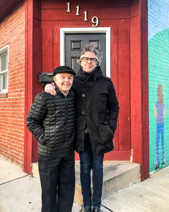 Ira Glass stands outside his family’s old grocery store on 1119 Bayard St with his father Barry Glass.