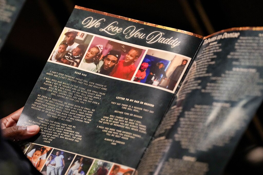Mourners read along with written remarks as speakers eulogize Dontae Melton Jr. during his funeral at DreamLife Worship Center in Randallstown, Md. on Saturday, July 12, 2025. The 31-year-old died in police custody in June, just one day after his mother had attempted to file an emergency petition in court out of concern for his mental health.