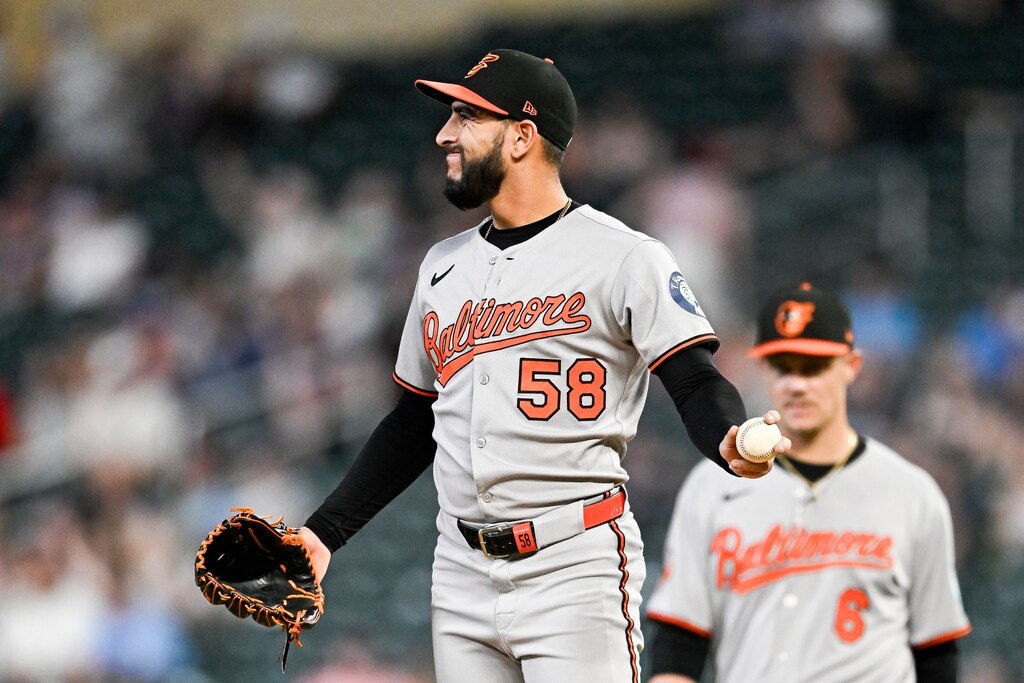Cionel Pérez #58 of the Baltimore Orioles reacts after giving up a walk in the seventh inning against the Minnesota Twins at Target Field on May 6, 2025 in Minneapolis, Minnesota.