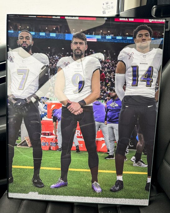 A Ravens poster board featuring, from left, wide receiver Rashod Bateman, kicker Justin Tucker and safety Kyle Hamilton that Ravens fan Angela Hester gave to her sister, Kimberly, on Christmas in 2024.