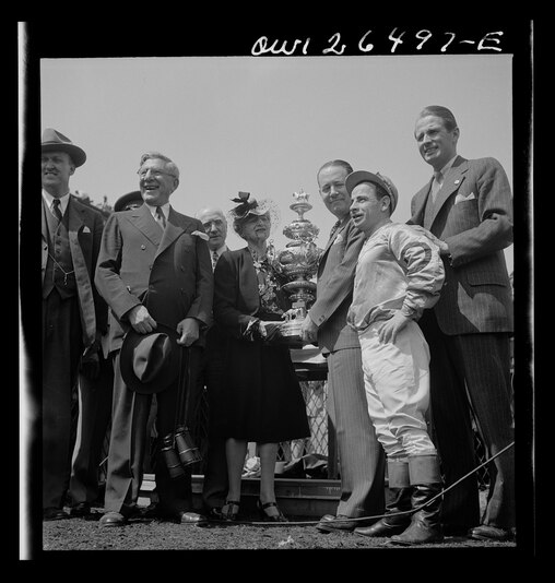 The owner and jockey of Count Fleet receiving the Preakness Cup in 1943.