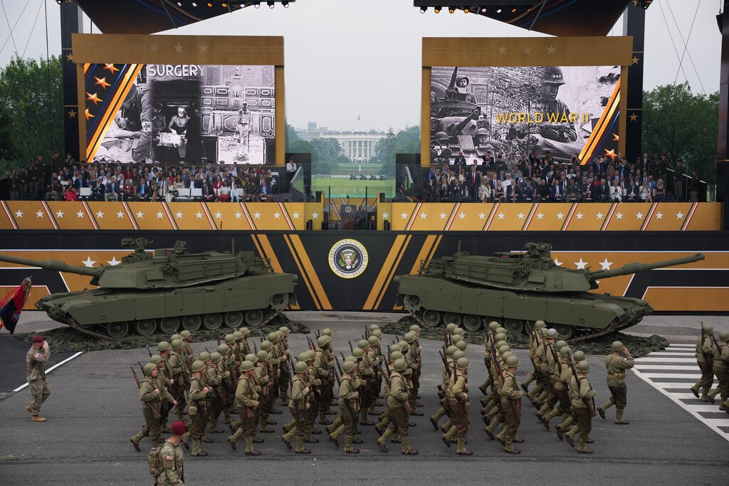 WASHINGTON, DC - JUNE 14: U.S. President Donald Trump and guests watch as members of the U.S Army parade down Constitution Avenue marking the 250th birthday of the U.S. Army June 14, 2025 in Washington, DC. The U.S. Army is marking its 250th birthday with a military parade including roughly 6,600 troops, 150 vehicles, and over 50 aircraft. The parade, which coincides with President Donald Trump's 79th birthday, is designed to tell the history of the Army.