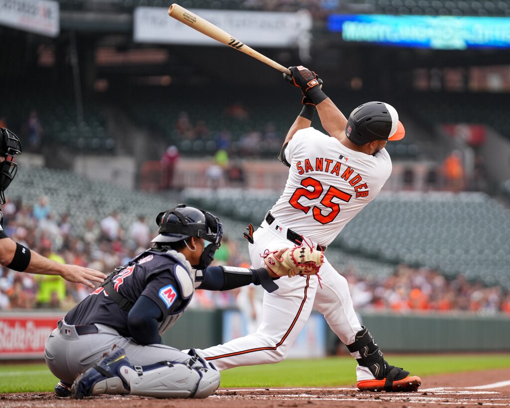 Baltimore Orioles outfielder Anthony Santander (25) connects with a pitch in the second game of a series against the Cleveland Guardians at Camden Yards on June 25, 2024.