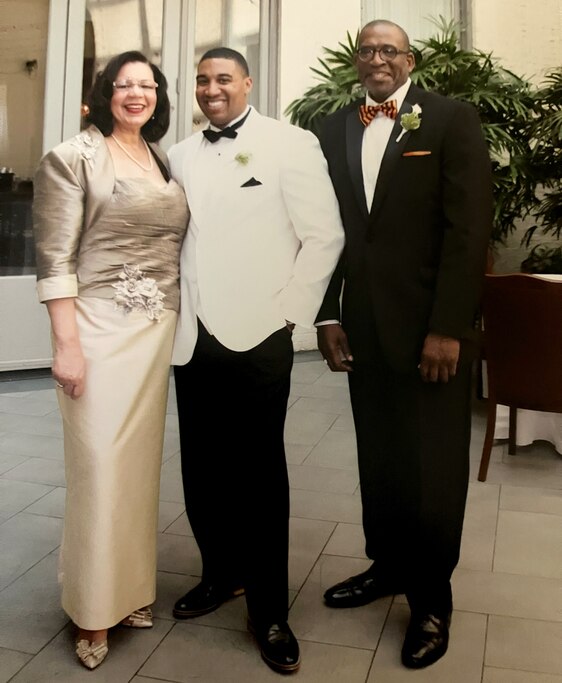 Doc Manning, right, with his wife Michelle Frazier and stepson David Frazier-Jacobs.
