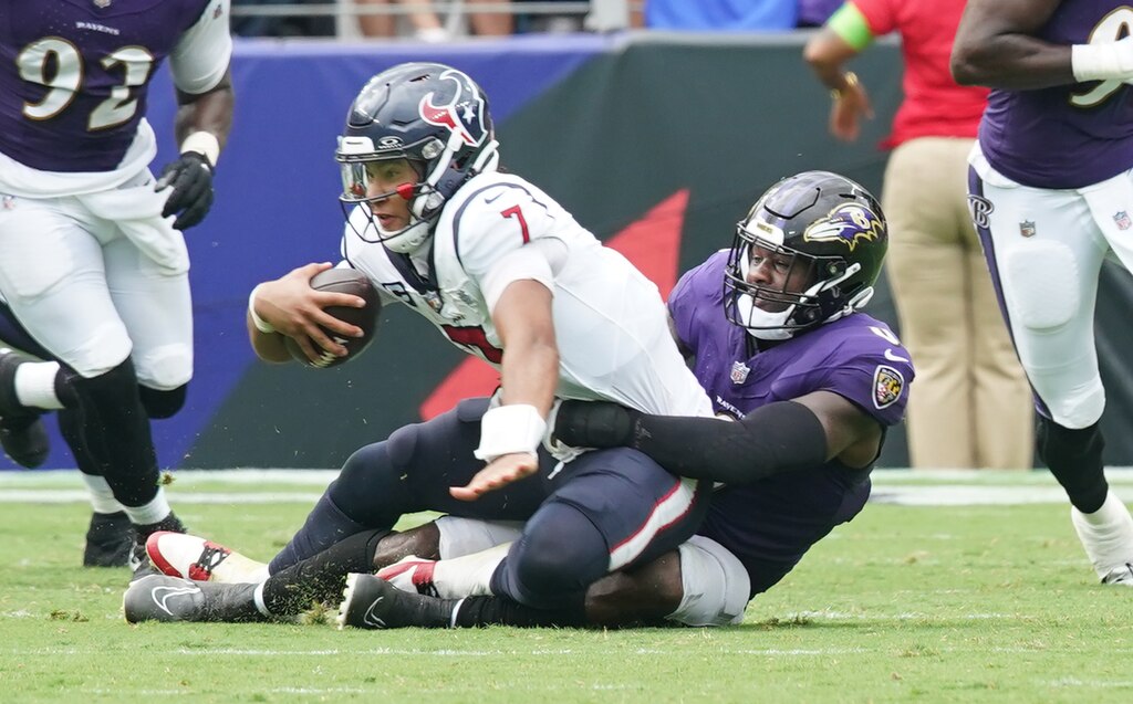 Baltimore Ravens linebacker Roquan Smith (0) sacks Texans’ quarterback C.J. Stout in the 3rd quarter in the Ravens 25-9-victory at the M&T Stadium Sept. 10, 2023.