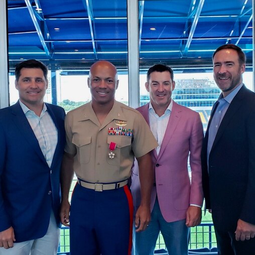 Brian Ellis, right, with friends Chad Chatlos, Ché Bolden, and Mark McGinnis at a retirement party for Bolden.