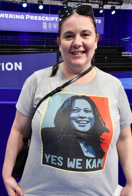 Virginia resident Amanda Linton shows off her "Yes We Kam" T-shirt after an event with President Joe Biden and Vice President Kamala Harris at Prince George's Community College on Thursday, Aug. 15, 2024.