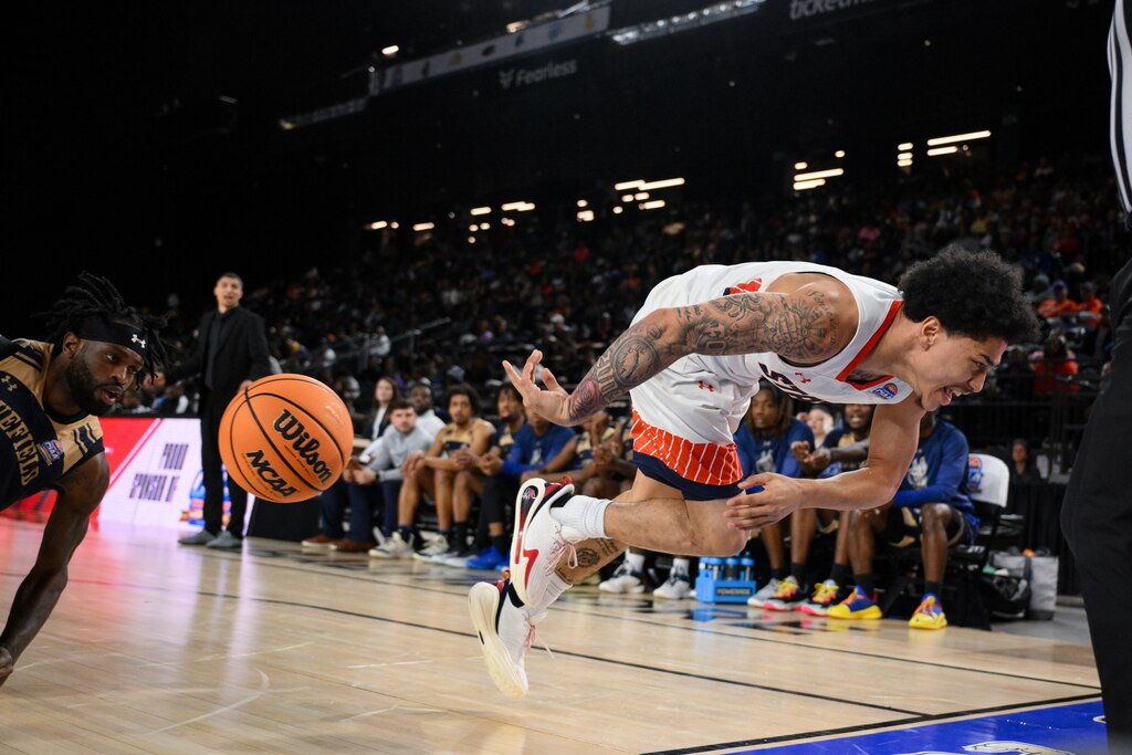 Virginia State guard Jacob Cooper saves the ball from going out of bounds during the second half of the CIAA men’s final college basketball game against Bluefield State, Saturday, Mar. 1, 2025, in Baltimore, Md.