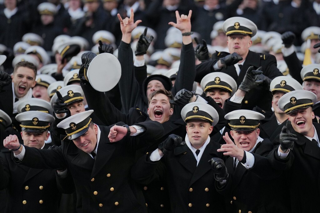 Navy midshipmen celebrate during the 125th Army-Navy football game at Northwest Stadium on December 14, 2024 in Landover, Maryland.