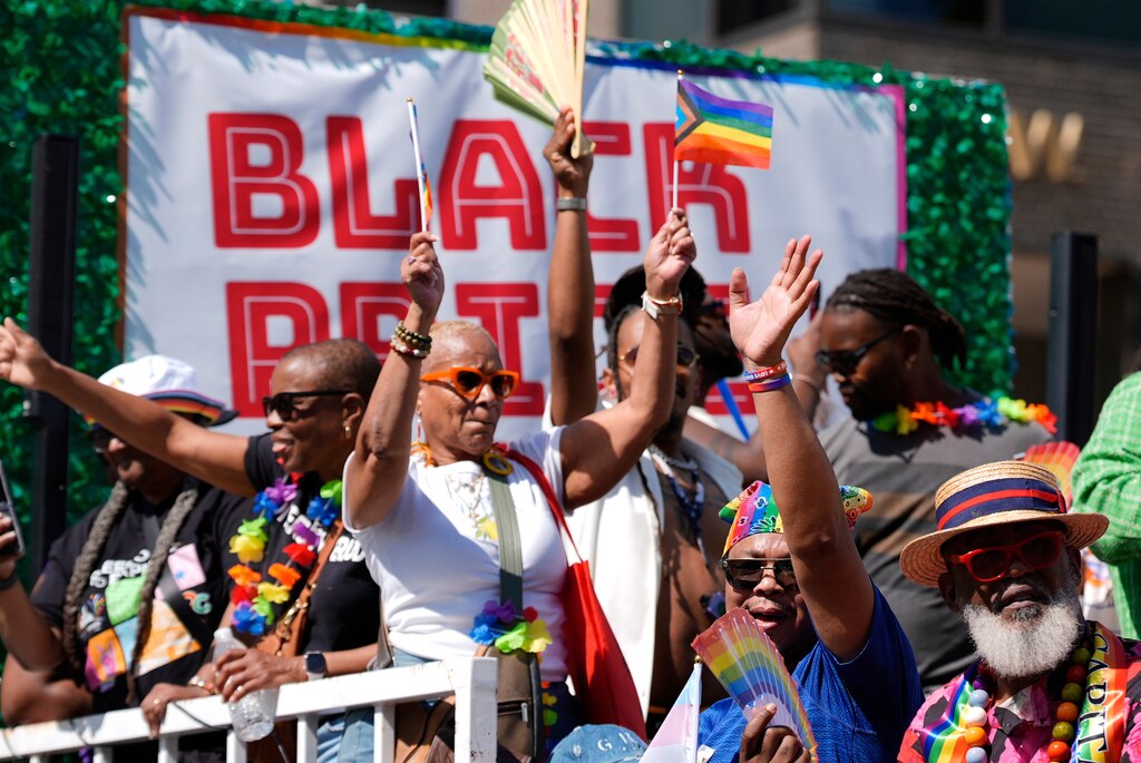 Participants dance on a float during the World Pride parade, Saturday, June 7, 2025, in Washington. (AP Photo/Mark Schiefelbein)