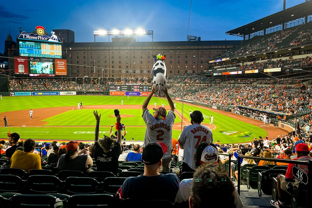 Fans celebrate as Colton Cowser breaks the Texas Rangers’ no-hitter in the eighth inning as the Baltimore Orioles play the Texas Rangers at Orioles Park at Camden Yards in Baltimore during Pride Night on Wednesday, June 25, 2025.