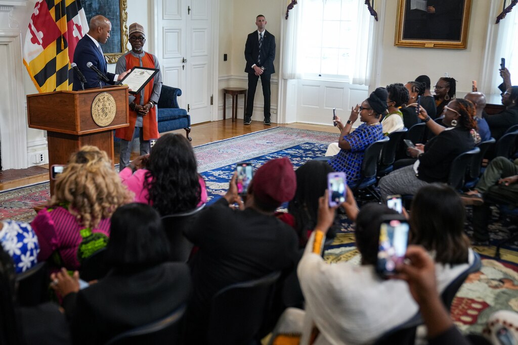 Gov. Wes Moore (left) stands with Chukwunonso “Vincent” Iweanoge, chair of the Governor's Commission on African Affairs, as they proclaim September as African Heritage Month during a news conference inside the Maryland State House on September 10, 2024.