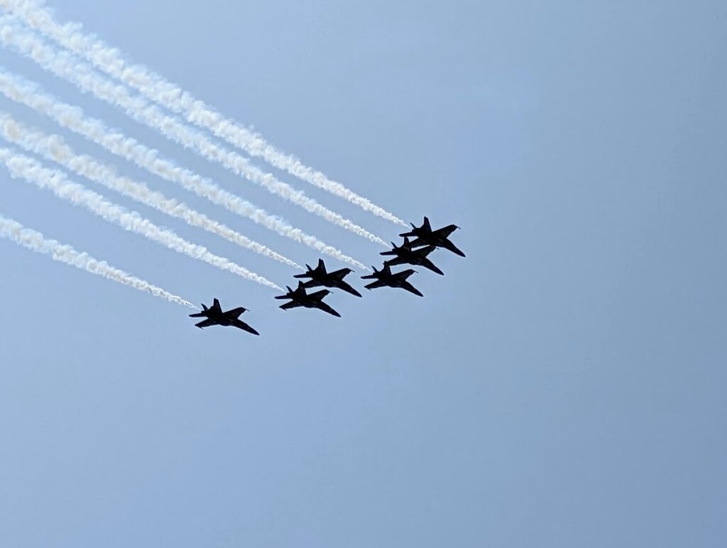 The six Navy Super Hornets fly above the Severn River on Wednesday, a little too high for my cell phone camera even in a high density format.