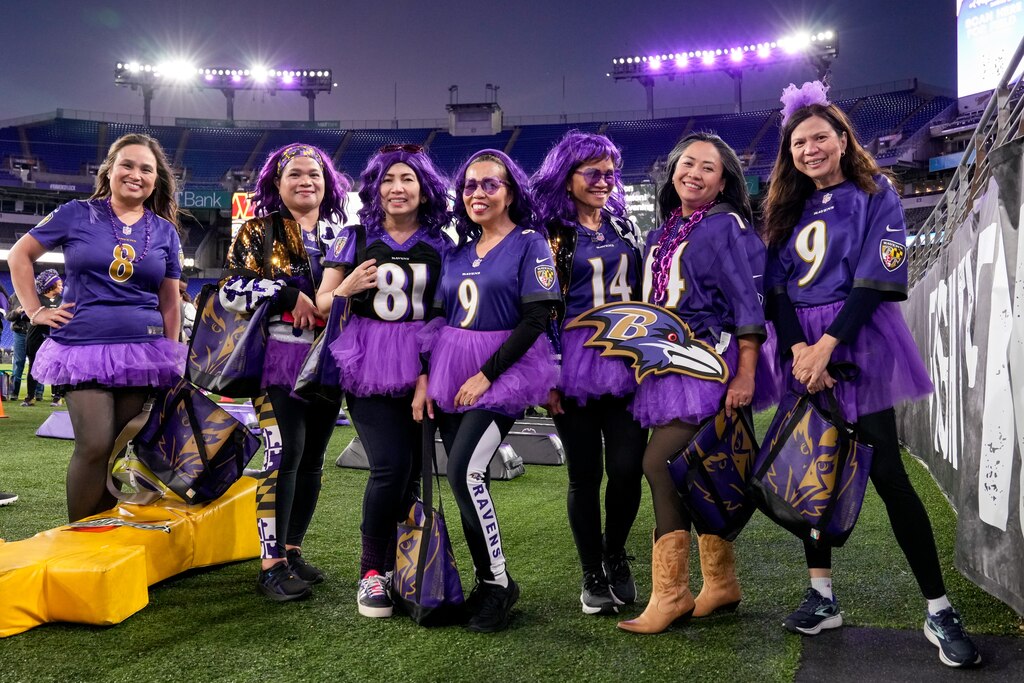 A group of friends poses for a photo during A Purple Evening, the Baltimore Ravens’ annual women’s event, at M&T Bank Stadium in Baltimore on Monday, October 14, 2024.