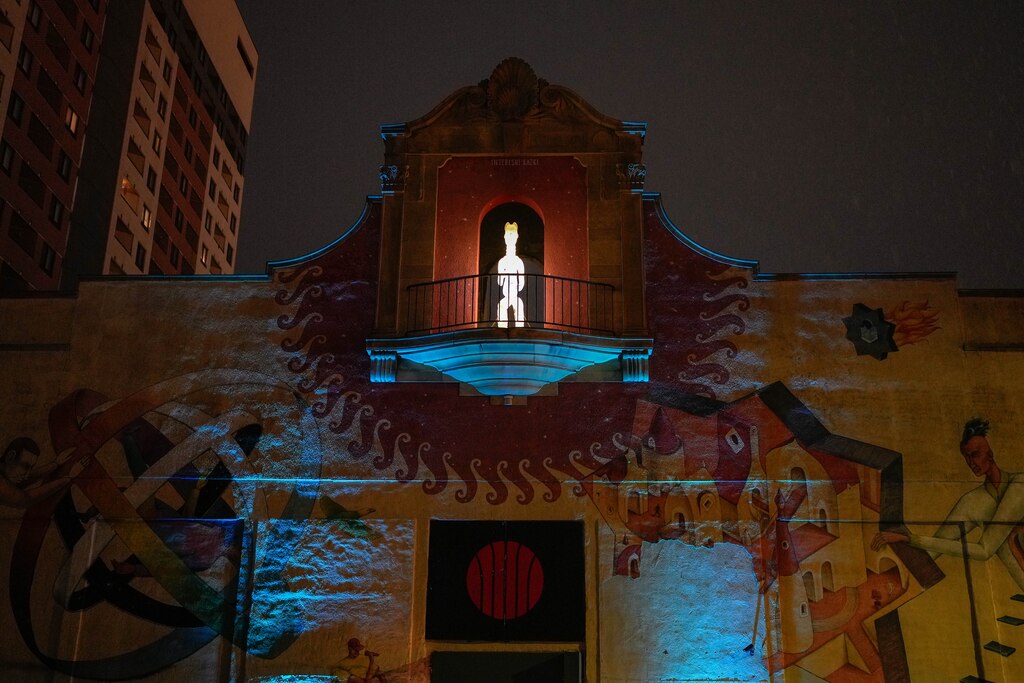 The “Third Watch” installation, created by artist Zoë Charlton, is seen lit up on top of North Avenue Market in Baltimore, Md. on Friday, March 28, 2025.