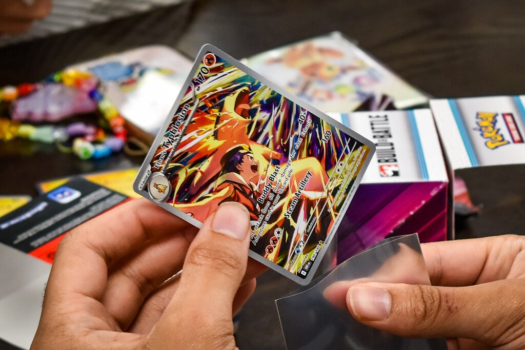 Jalen Manley places a card he had hoped to find and was lucky enough to pull out of a pack into a protective sleeve at Game Haven in Pikesville before a pre-release tournament on Sunday, May 25, 2025.