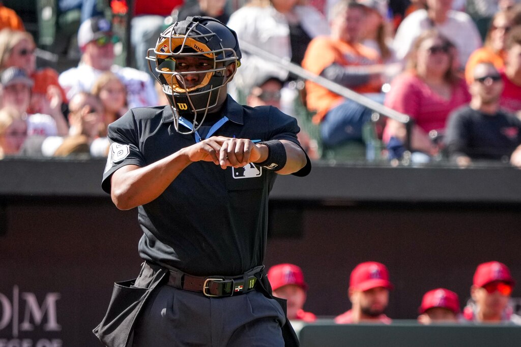 An umpire calls a pitch clock violation against the Los Angeles Angels in a game against the Baltimore Orioles at Camden Yards on March 31, 2024. The Orioles lost to the Angels, 4-1, on Sunday afternoon.