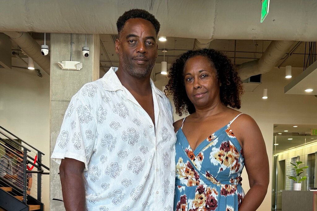 From left, Roland White Jr. and Cathleen Dean. White swam for Loyola Blakefield in Towson and Dean is the director of the documentary film "Wade In The Water."