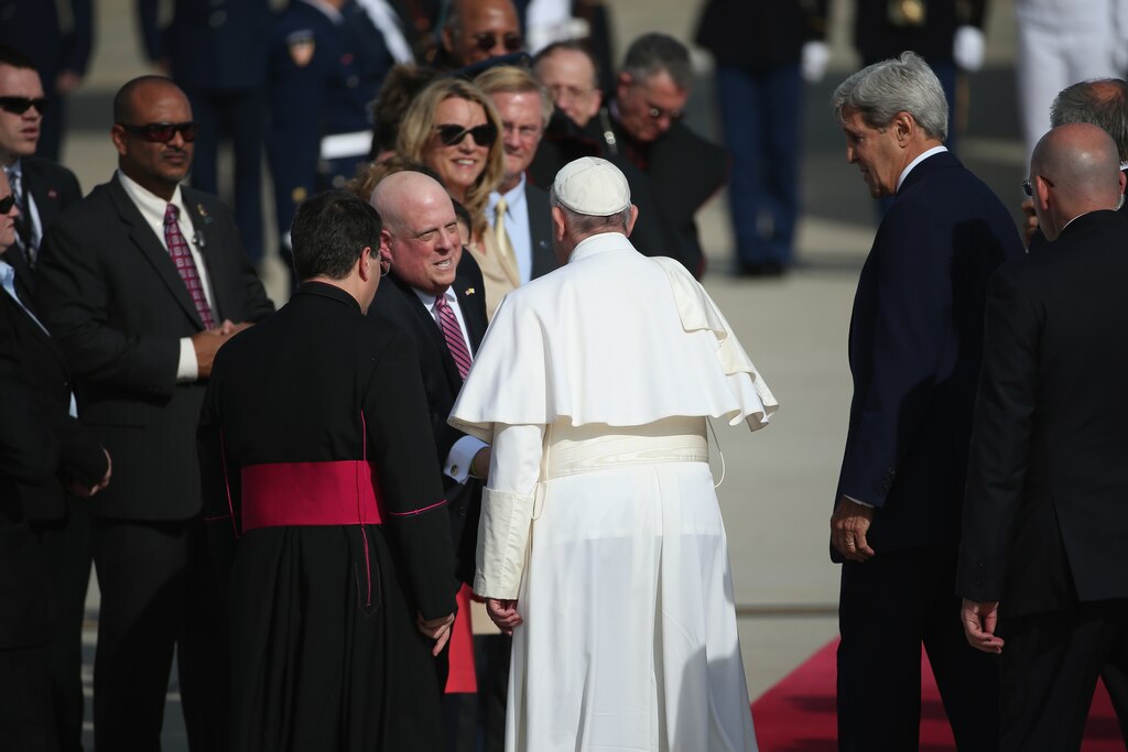 JOINT BASE ANDREWS, MD - SEPTEMBER 24: Pope Francis greets Maryland Gov. Larry Hogan as Secretary of State John Kerry looks on before the Pope departs from Washington, DC en route to New York City on September 24, 2015 in Joint Base Andrews, Maryland. aThe Pope is on a six-day trip to the U.S., with stops in Washington, New York City and Philadelphia.