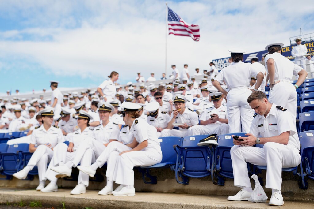 Midshipmen wait for the graduating class procession to the field to begin at the 2025 Naval Academy graduation at Navy-Marine Corps Memorial Stadium in Annapolis, Md., on Friday, May 23, 2025.