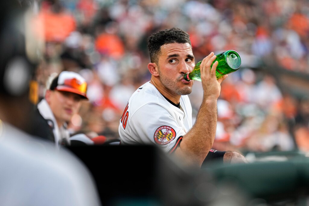 Baltimore Orioles outfielder Ramón Laureano (12) drinks water in the dugout during a game against the Texas Rangers at Orioles Park at Camden Yards in Baltimore, Md. on Monday, June 23, 2025.