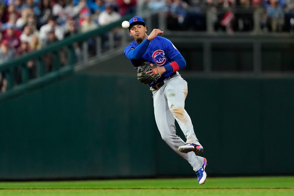 Chicago Cubs shortstop Luis Vázquez throws to first after fielding a groundout by Philadelphia Phillies' Trea Turner during the sixth inning of a baseball game, Monday, Sept. 23, 2024, in Philadelphia.