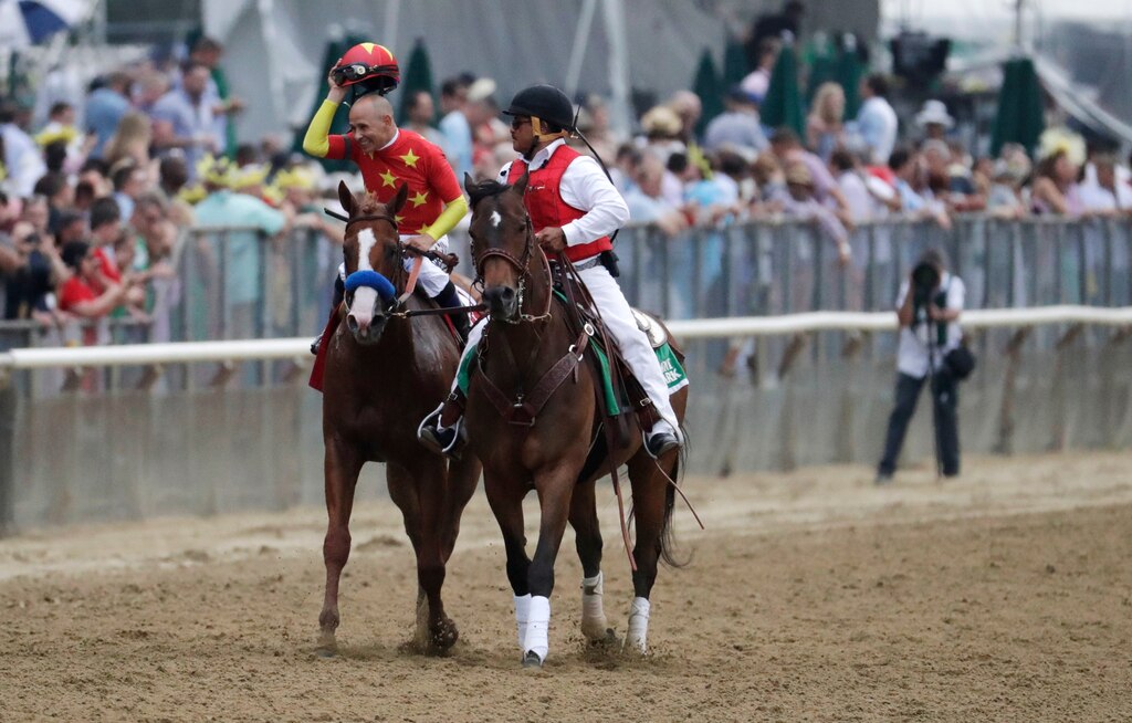 Jockey Mike Smith reacts after guiding Justify to win the 150th running of the Belmont Stakes horse race and the Triple Crown, Saturday, June 9, 2018, in Elmont, N.Y.