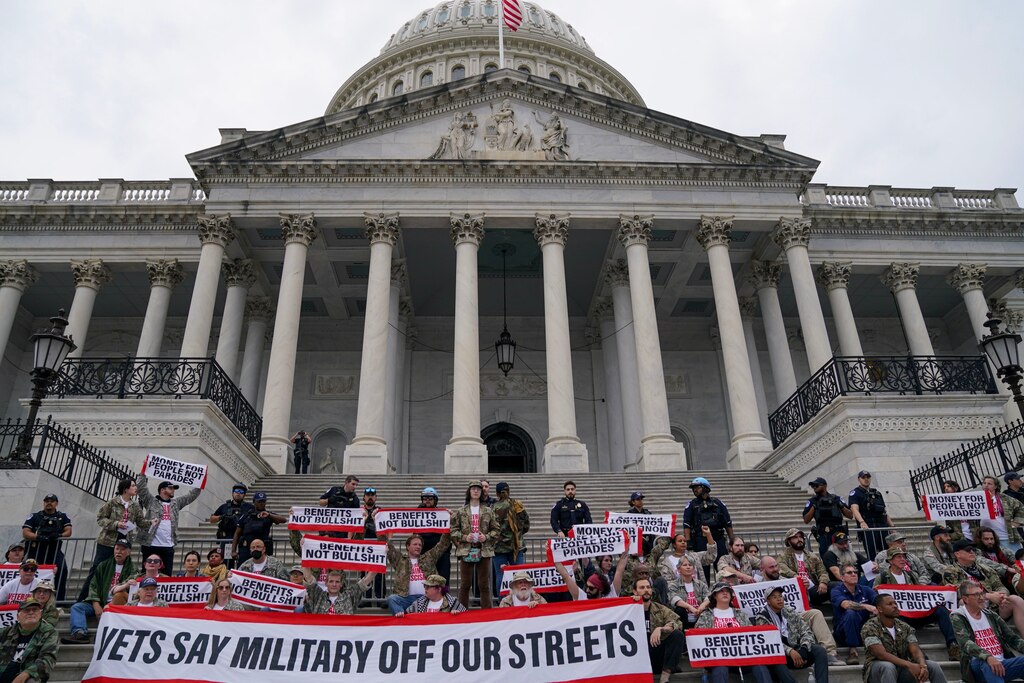 WASHINGTON, DC - JUNE 13: Demonstrators breach a U.S. Capitol building barrier while protesting the upcoming parade for the Army’s 250th anniversary, which falls on President Donald Trump's birthday, on June 13, 2025 in Washington, D.C.