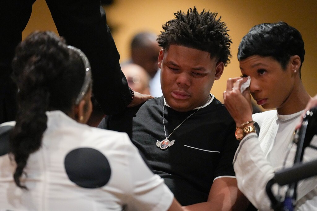 Jadon Melton, Dontae Melton Jr.’s son, is comforted by fellow mourners during his funeral at DreamLife Worship Center in Randallstown, Md. on Saturday, July 12, 2025. The 31-year-old died in police custody in June, just one day after his mother had attempted to file an emergency petition in court out of concern for his mental health.